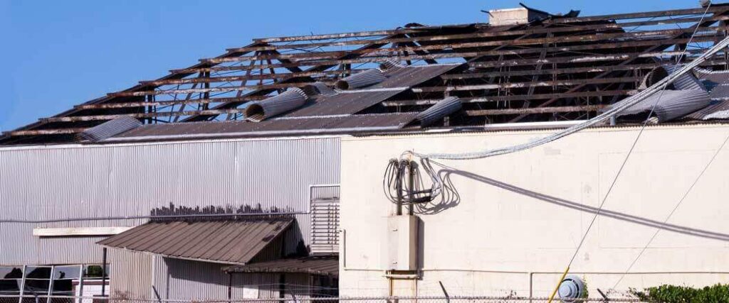 Post hurricane recovery is vital for businesses such as this one, which has lost its roof in a cyclone.